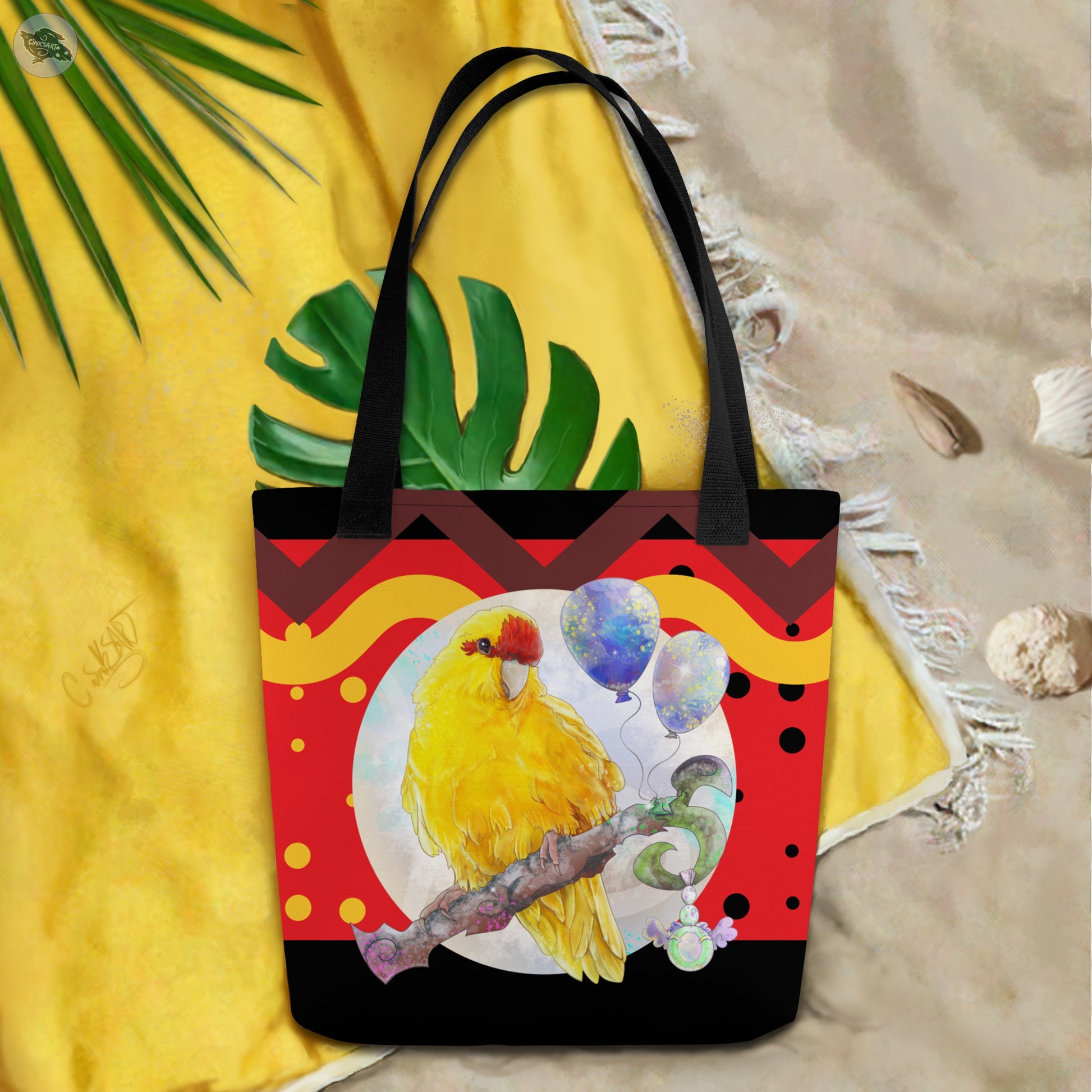 Yellow and Red Kakariki Parrot tote bag - Beach bag shopping tote - for bird lovers and parrot owners - front view on a beach towel - Design and mockup by Cinksart 2024 Copyright - Perroquet Kakariki Jaune et rouge sac fourre-tout collection plage 2024